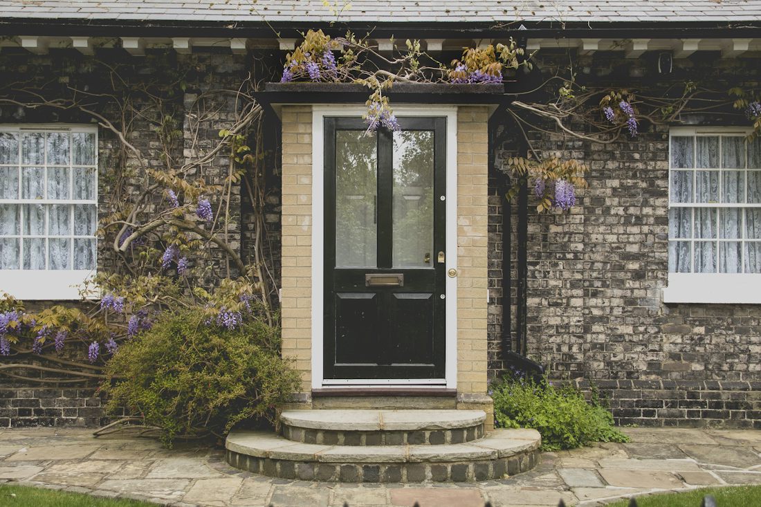 New front entry door on a brick house