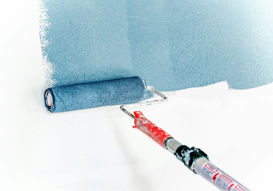 Paint roller on a wall
